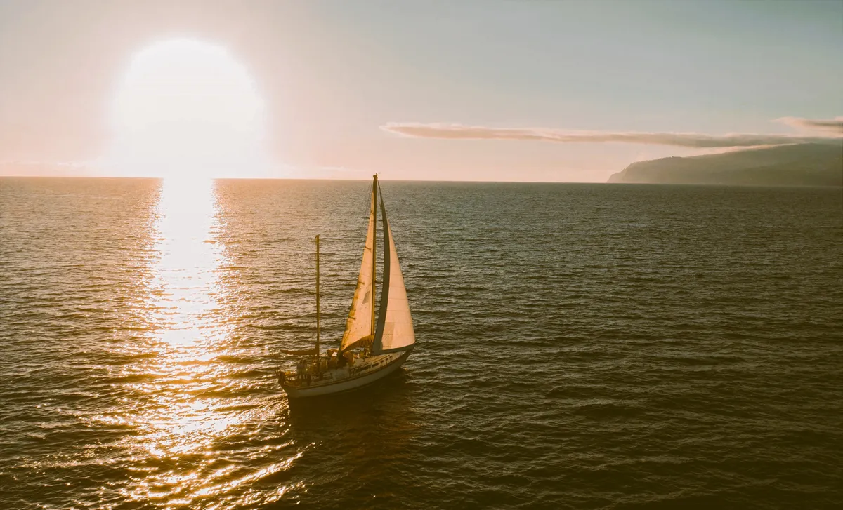 The classic ketch Spica sailing at sunset