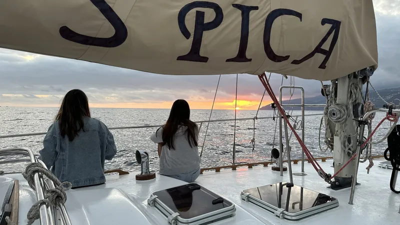 Two guests watching the sunset from the deck