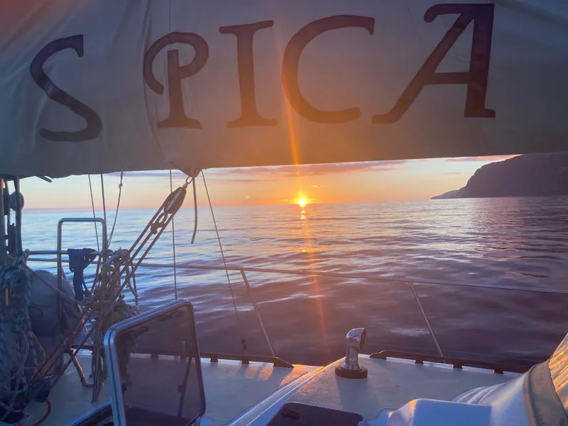 Spica Yacht with the sun setting behind